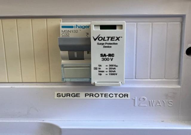 Surge protector in switchboard